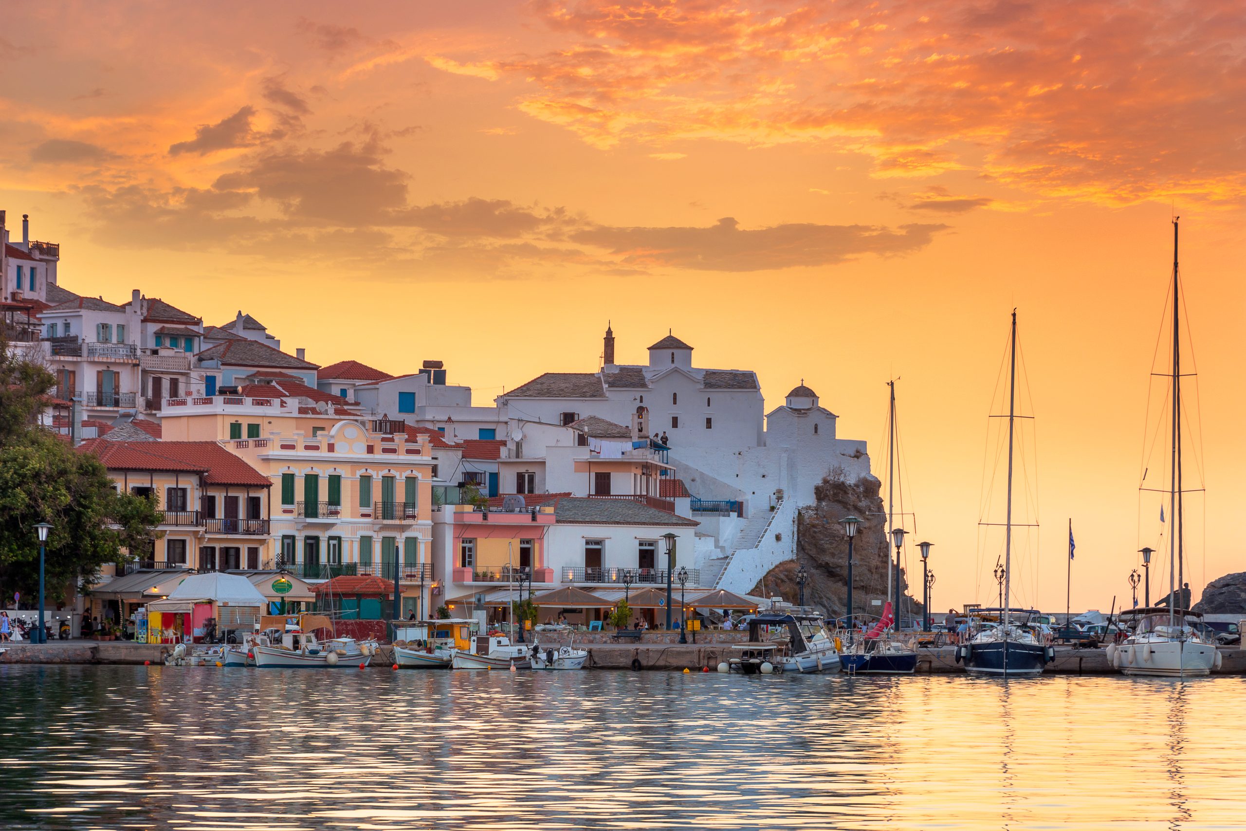 View of town and port at the island Skopelos, northern Sporades, Greece
