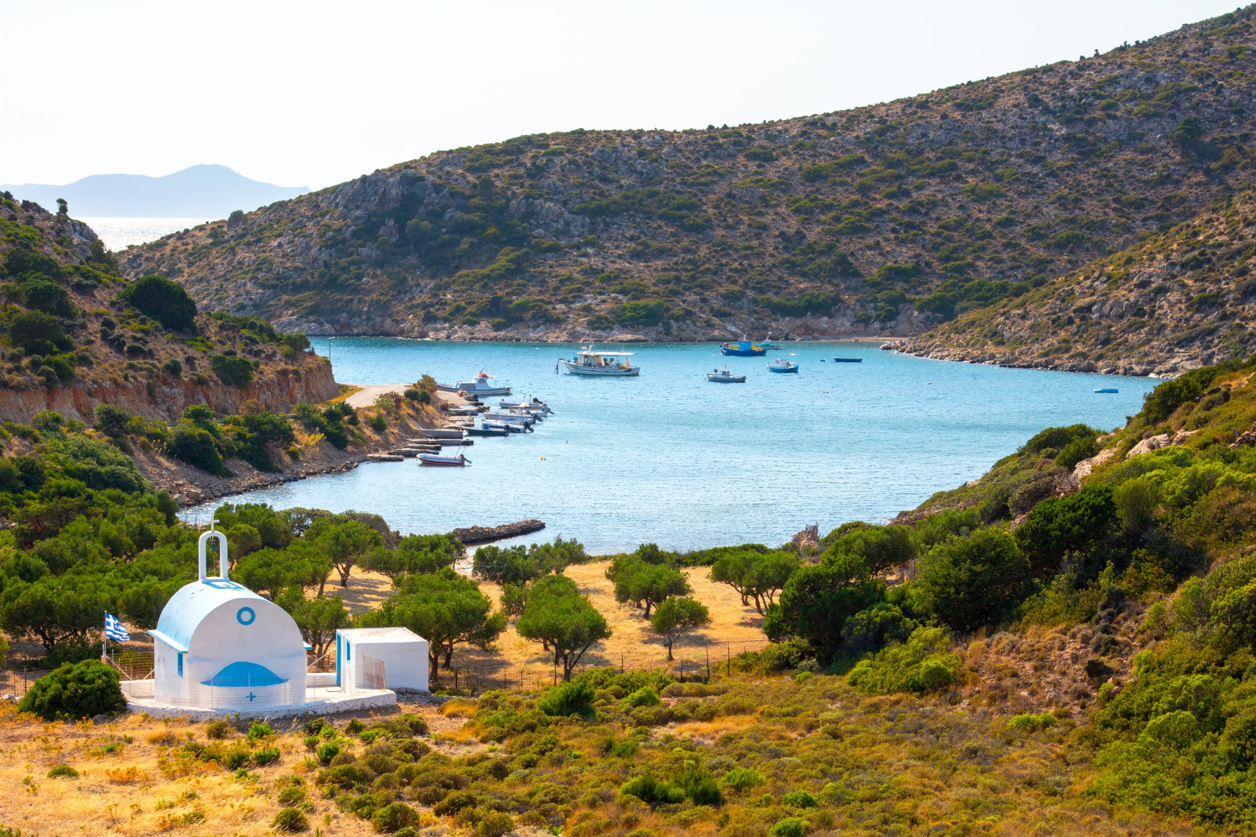 Scenic anchorage in the Northern Dodecanese — white church on Lipsi island, Greece