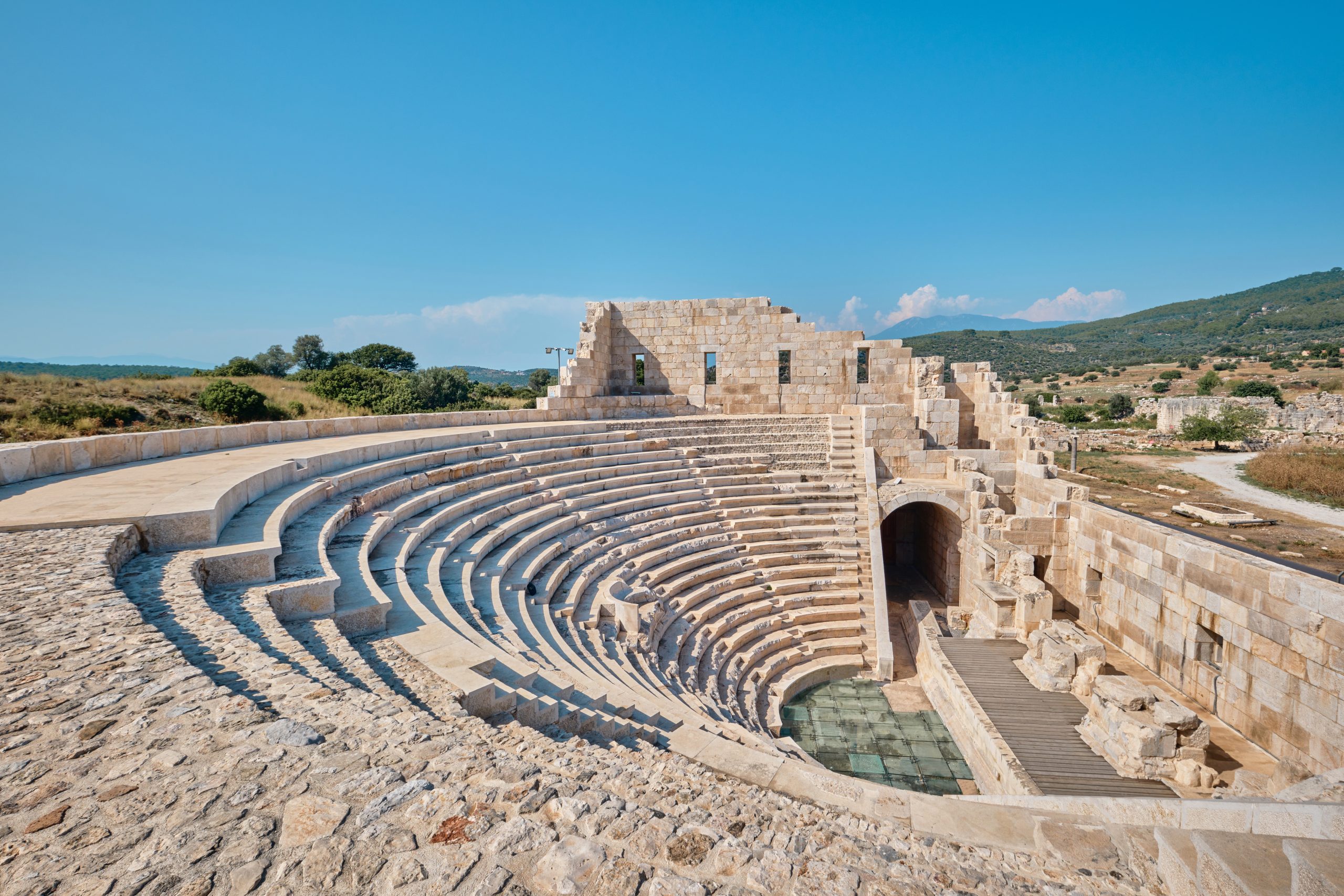 Antalya, Turkey - July 19, 2023: Ruins of the ancient Lycian city Patara. Theatre and the Assembly hall of Lycia public. Patara was at the Lycia (Lycian) League's capital.